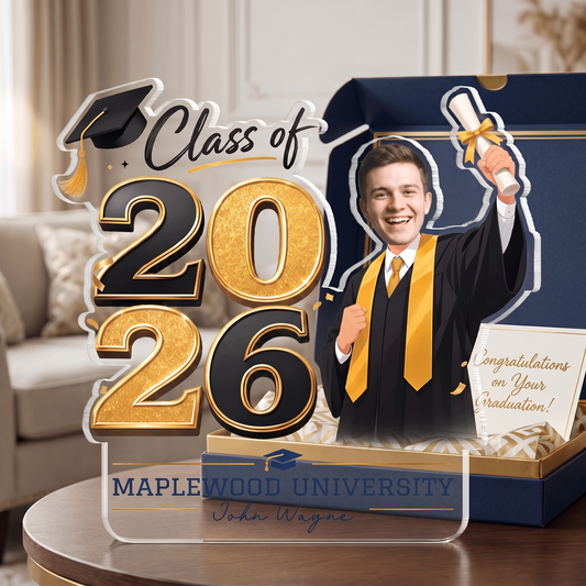 Clear acrylic Class of 2026 plaque with a custom photo graduate in gown, gold numbers and custom school name beside a gift box