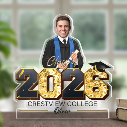 Class of 2026 gold foil acrylic plaque with custom photo of male graduate holding a diploma by a window