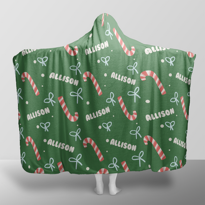 Personalized candy cane bow pattern Christmas hooded blanket with custom name, back view