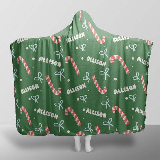 Personalized candy cane bow pattern Christmas hooded blanket with custom name, back view