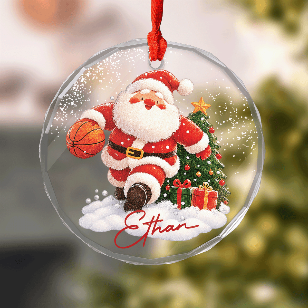 Round clear glass ornament with Santa dribbling a basketball by a Christmas tree and a custom name