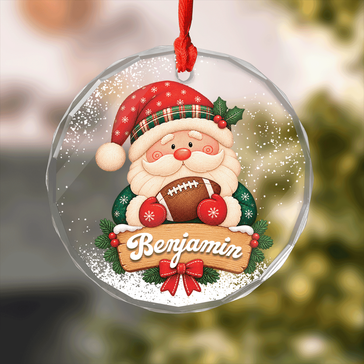 Round clear glass ornament with Santa hugging a football and a custom name wooden sign