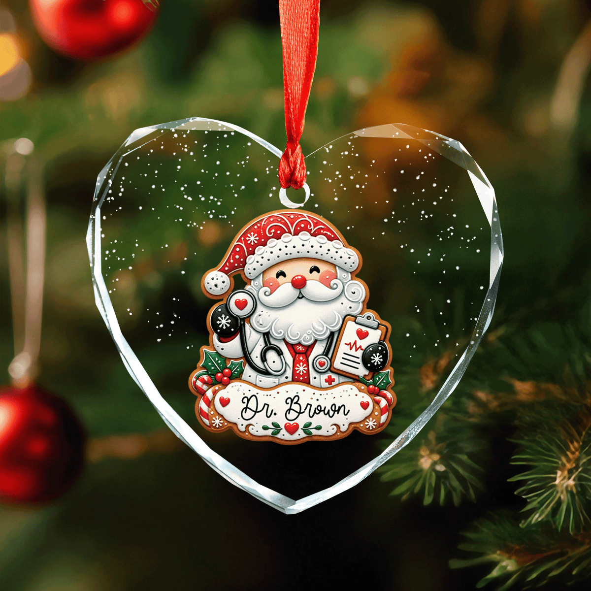 Heart shaped clear glass ornament with a gingerbread style Santa doctor, stethoscope and a custom name