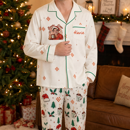 Man wearing custom face photo and name Santa crew cocoa mug Christmas pajamas by the tree
