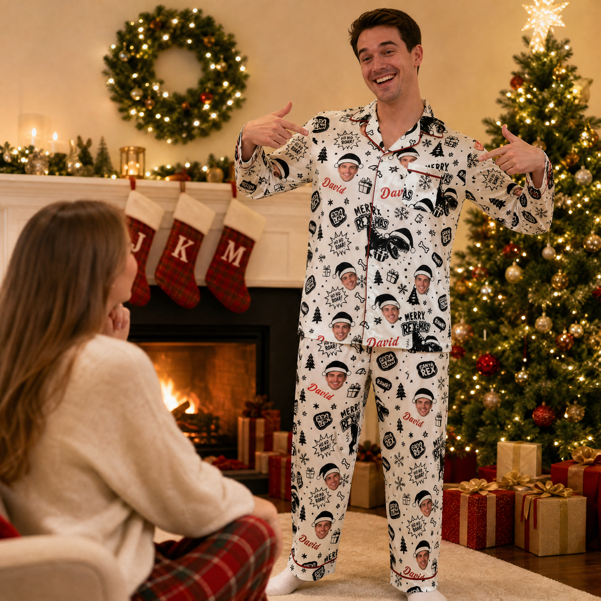 Man showing off custom face photo dinosaur Christmas pajamas by the fireplace