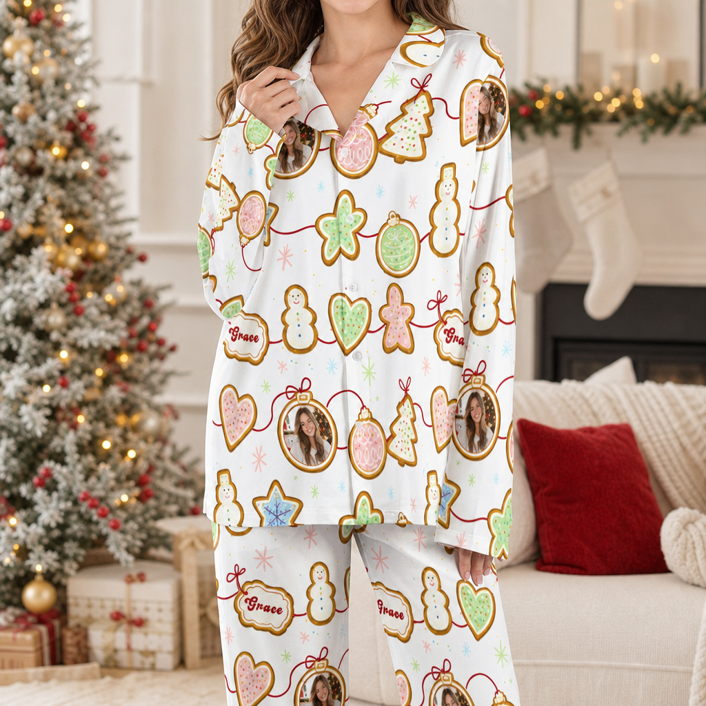 Woman wearing custom face photo and name gingerbread cookie garland Christmas pajamas by the tree