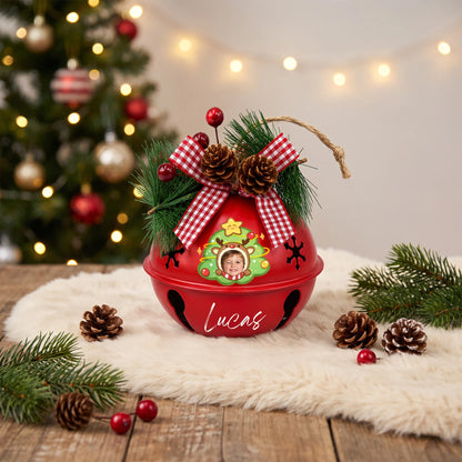 Personalized reindeer star tree kid photo jingle bell ornament on a festive table