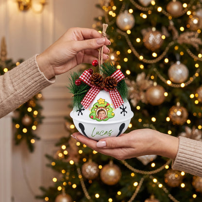 Hands holding a custom reindeer star tree kid photo jingle bell ornament