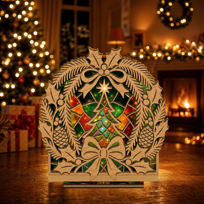 Christmas holly wreath suncatcher candle holder glowing on holiday table
