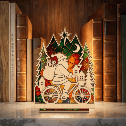 Christmas Santa riding bicycle suncatcher candle holder with village and pines