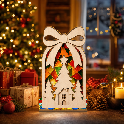 Christmas bow cottage suncatcher candle holder glowing on holiday table