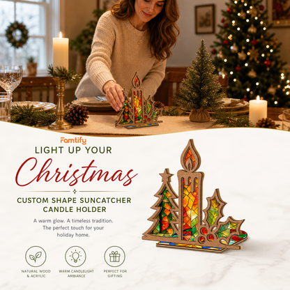 Christmas candle and holly suncatcher candle holder glowing on holiday table