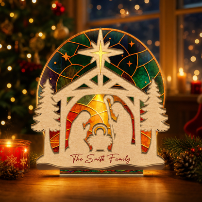 Personalized nativity family name suncatcher candle holder glowing on holiday table