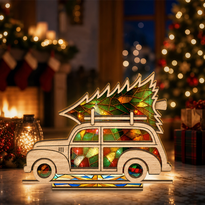 Christmas vintage car and tree suncatcher candle holder glowing on holiday table