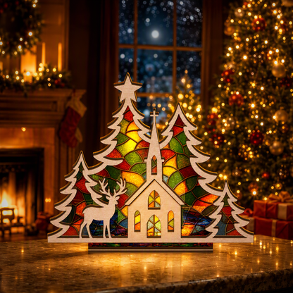 Christmas church and reindeer suncatcher candle holder glowing on holiday table