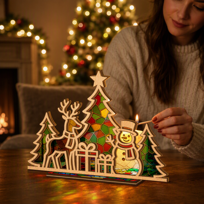 Christmas reindeer and snowman suncatcher candle holder on holiday table