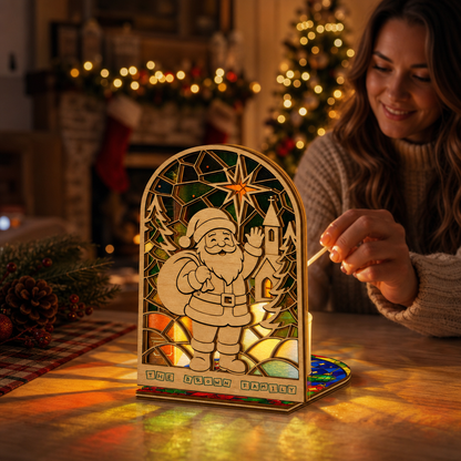 Personalized Santa family name suncatcher candle holder glowing on holiday table
