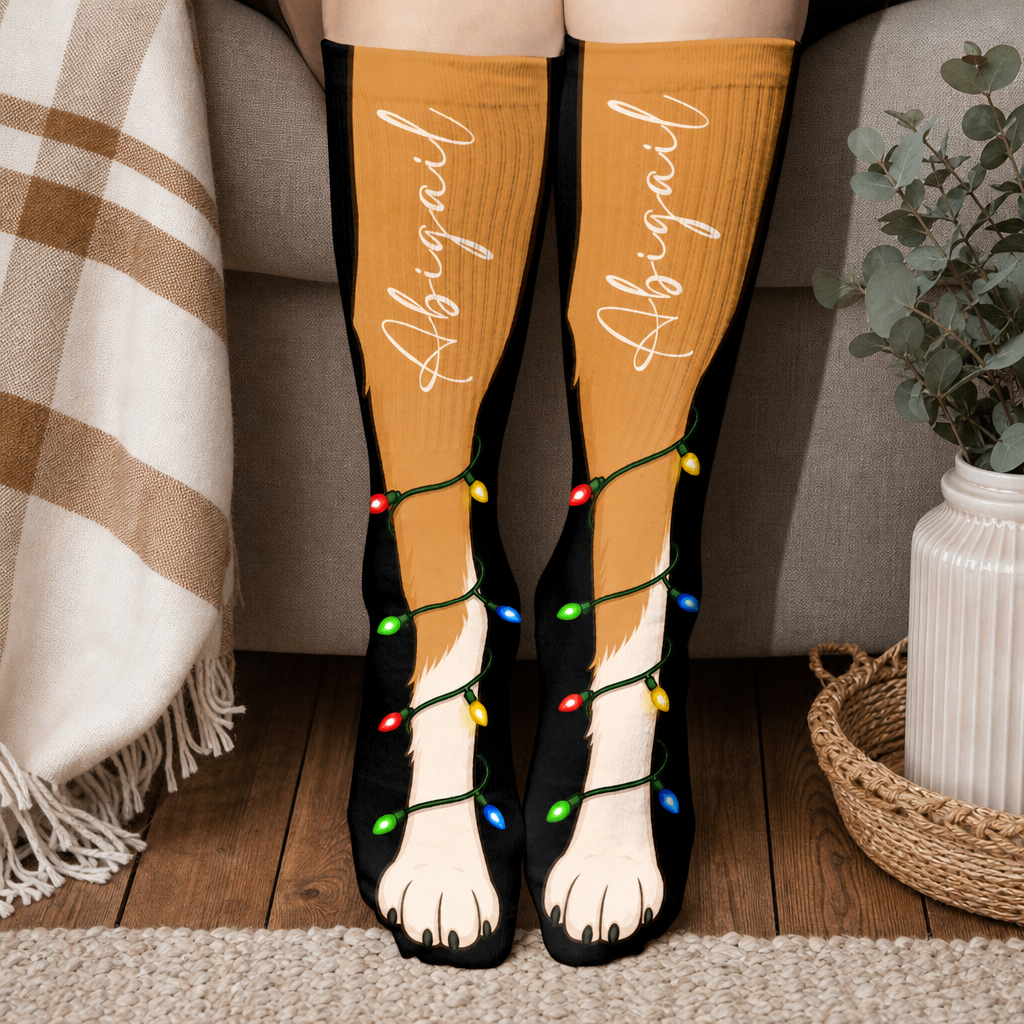Personalized Puppy Paw Christmas Lights Socks worn on a cozy sofa by the Christmas tree