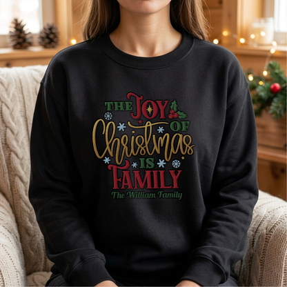 Woman wearing the black The Joy of Christmas Is Family embroidered sweatshirt with custom family name