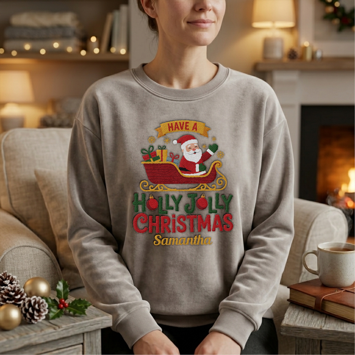 Woman wearing the heather grey Holly Jolly Christmas Santa Sleigh embroidered sweatshirt with custom name by a cozy fireplace