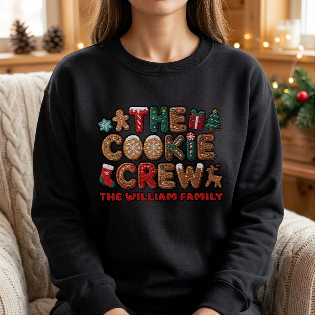 Woman wearing the black The Cookie Crew embroidered sweatshirt with custom family name