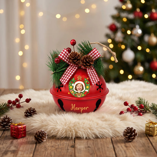 Personalized Christmas wreath kid photo jingle bell ornament on a festive table